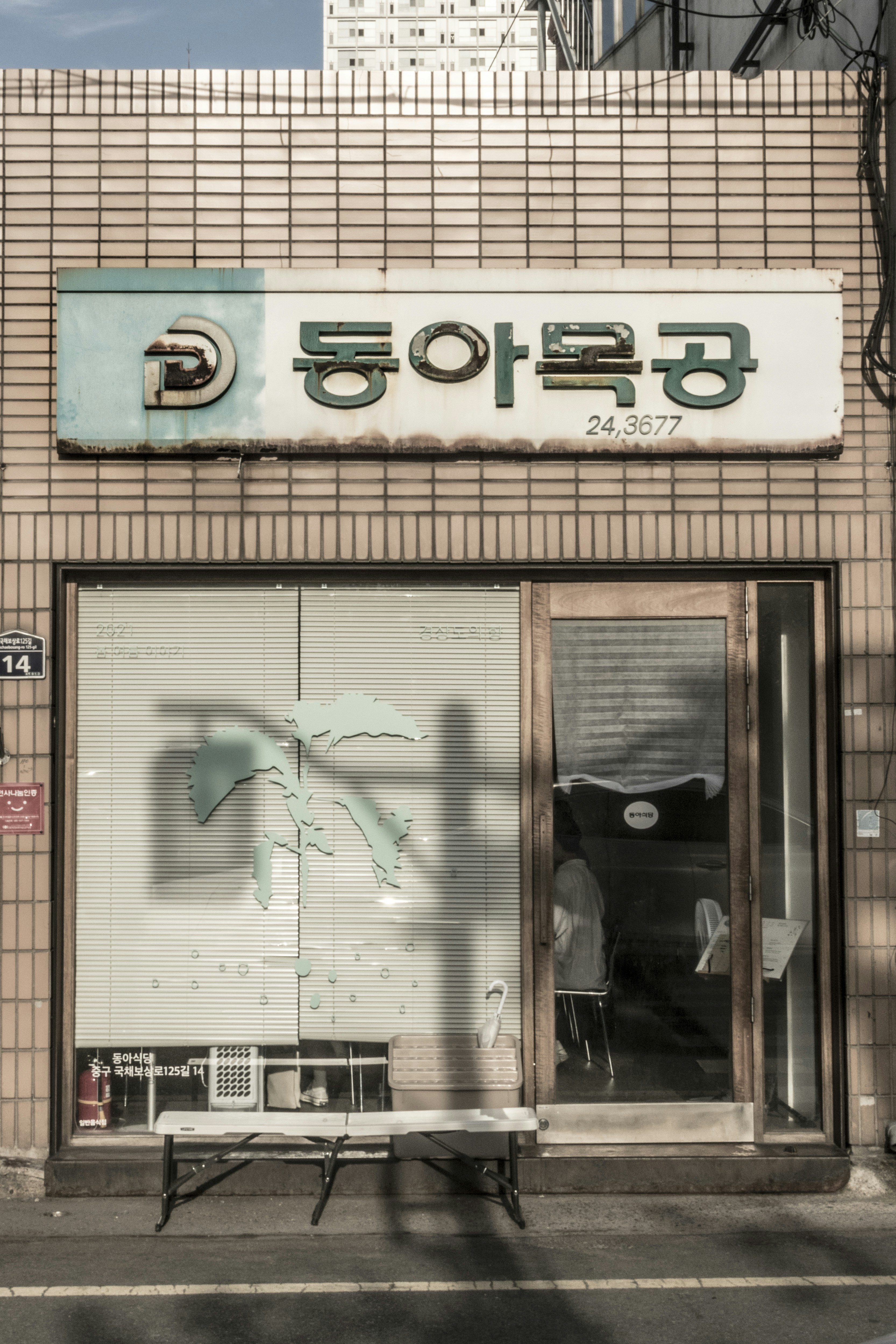 brown brick building with glass window